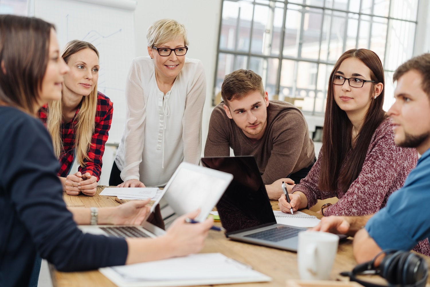 Group of diverse young adults in a meeting